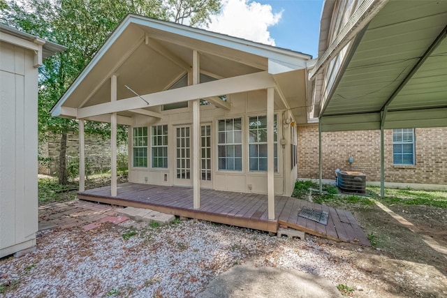 exterior space featuring a wooden deck and central AC