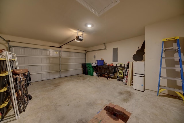 garage featuring a garage door opener and electric panel