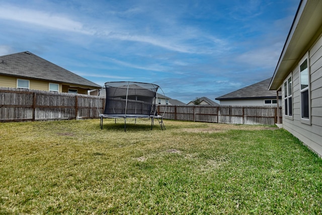 view of yard featuring a trampoline