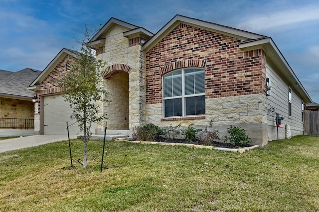 view of front of home with a garage and a front lawn