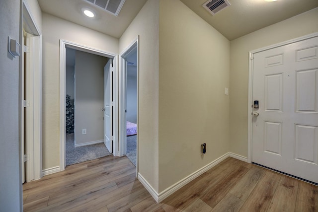 entryway with light hardwood / wood-style flooring