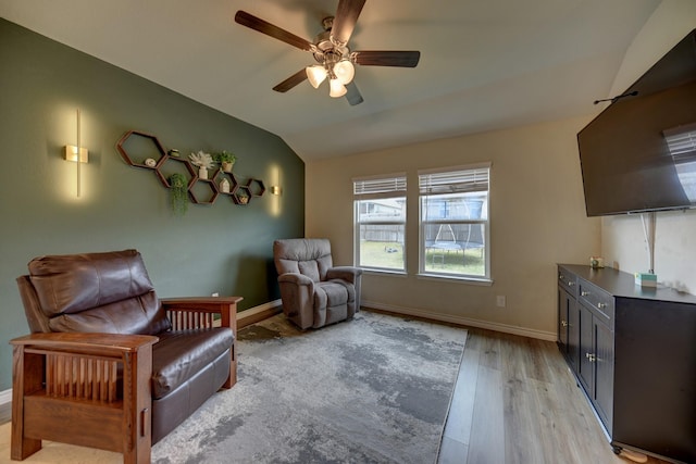 sitting room featuring vaulted ceiling, ceiling fan, and light hardwood / wood-style floors