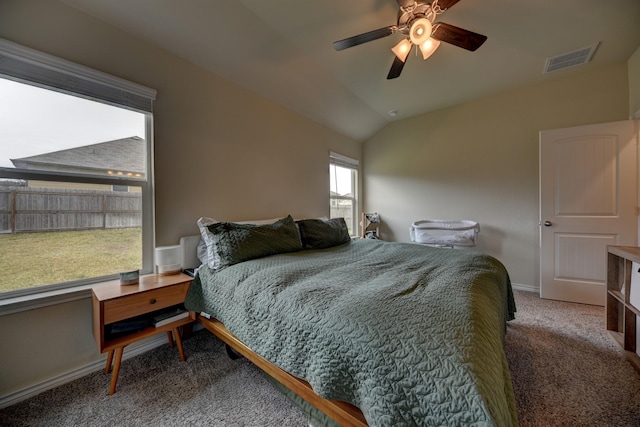 carpeted bedroom with lofted ceiling and ceiling fan