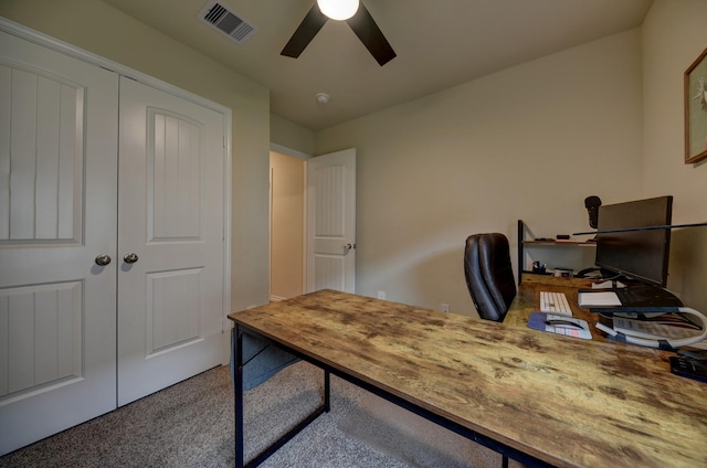 office with carpet floors and ceiling fan