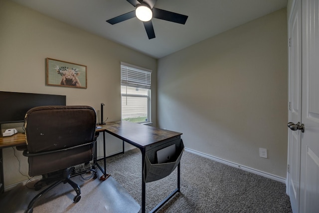 carpeted office featuring ceiling fan