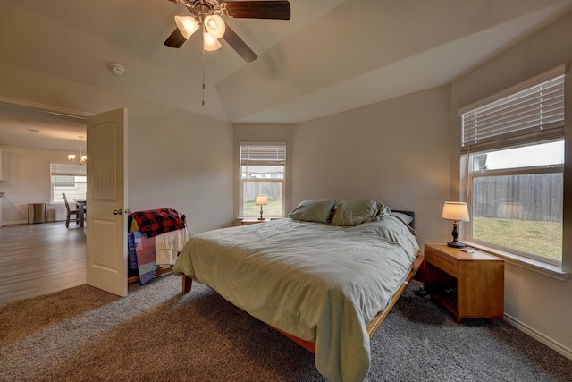 bedroom featuring vaulted ceiling, carpet floors, and ceiling fan