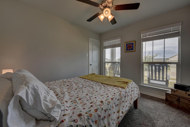 carpeted bedroom with ceiling fan