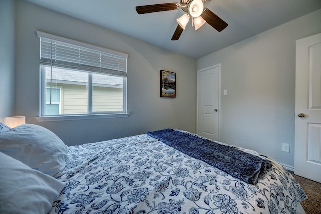 carpeted bedroom featuring ceiling fan