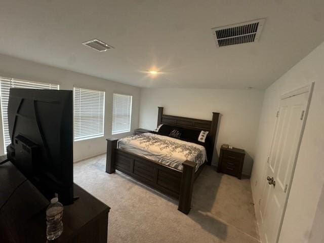 bedroom with light colored carpet