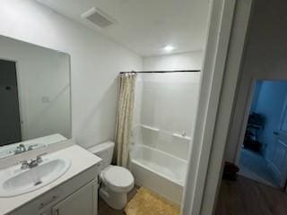 full bathroom with toilet, vanity, and shower / bathtub combination with curtain