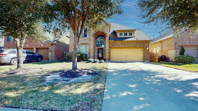 view of front of house featuring a garage and a front lawn