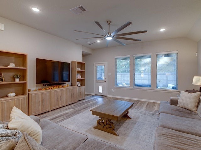 living room with ceiling fan and light wood-type flooring