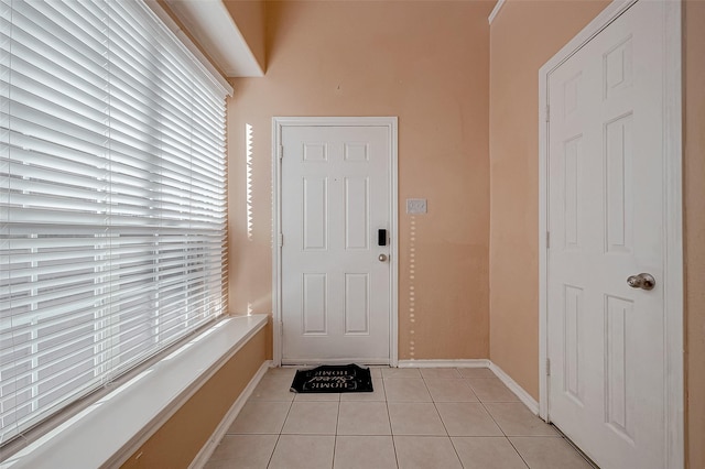 entryway featuring light tile patterned floors