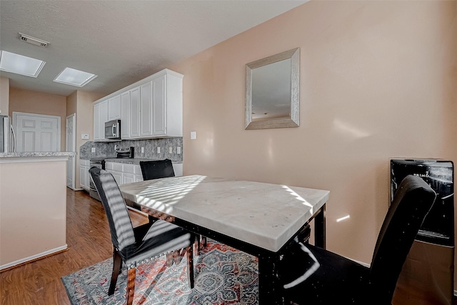 dining room featuring hardwood / wood-style floors