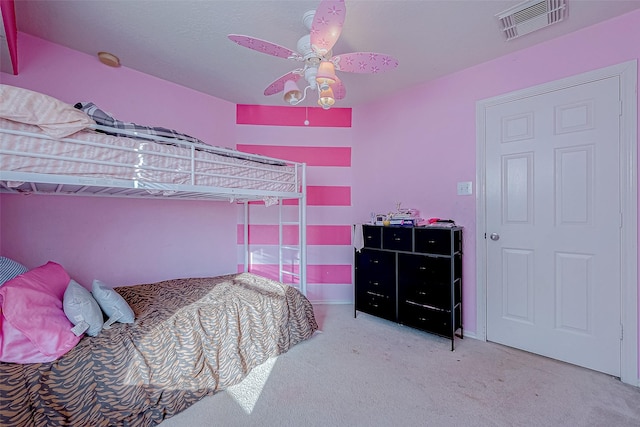 carpeted bedroom with ceiling fan