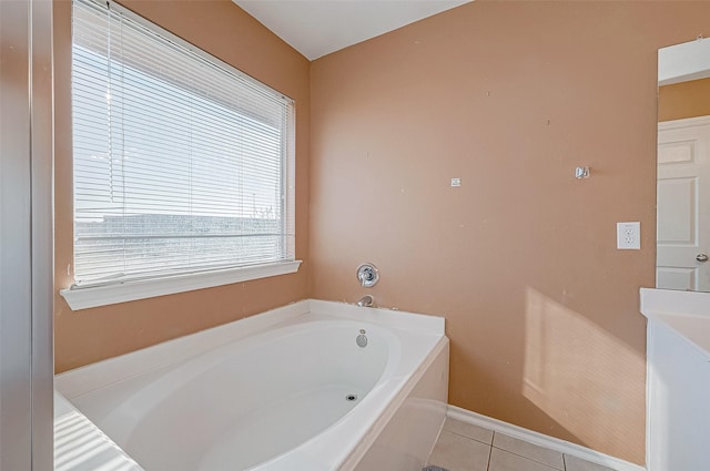 bathroom with tile patterned floors and a bathtub