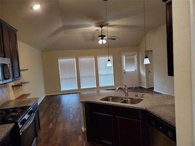 kitchen featuring light stone counters, sink, stainless steel appliances, and dark hardwood / wood-style floors