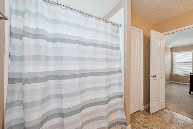 bathroom featuring a textured ceiling