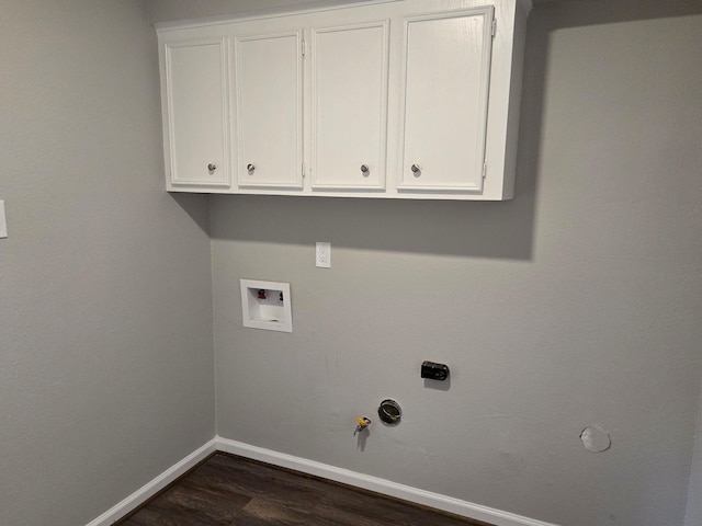 clothes washing area with gas dryer hookup, washer hookup, and dark hardwood / wood-style flooring