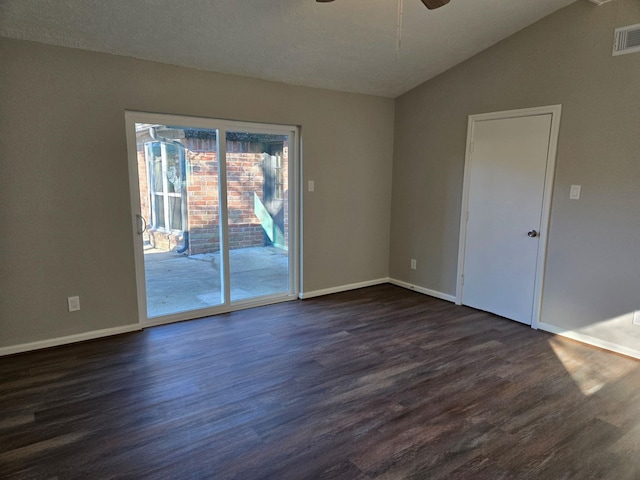 unfurnished room with ceiling fan, dark hardwood / wood-style flooring, and vaulted ceiling