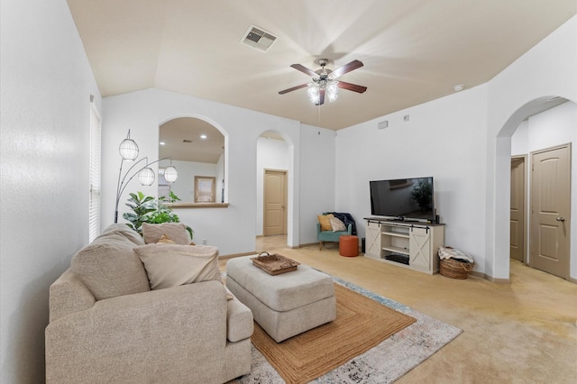 living room with lofted ceiling, carpet floors, and ceiling fan