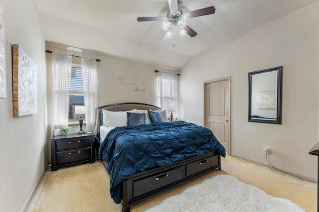 bedroom with lofted ceiling, multiple windows, light colored carpet, and ceiling fan