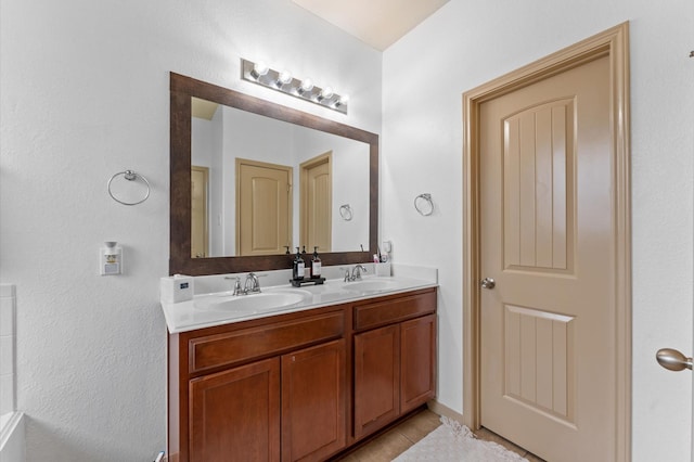 bathroom with tile patterned flooring and vanity