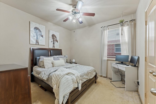 bedroom with ceiling fan and light carpet