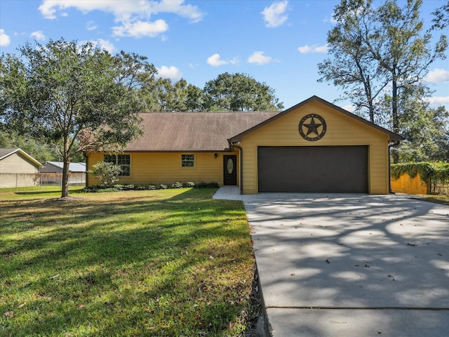 ranch-style home featuring a garage and a front lawn