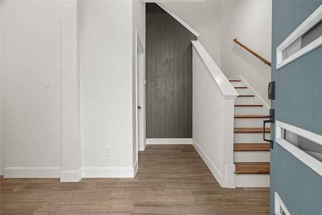 staircase featuring hardwood / wood-style flooring