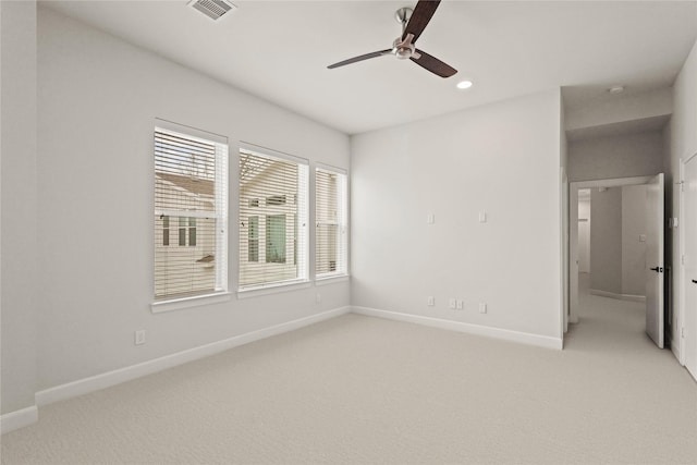 empty room with carpet floors and ceiling fan