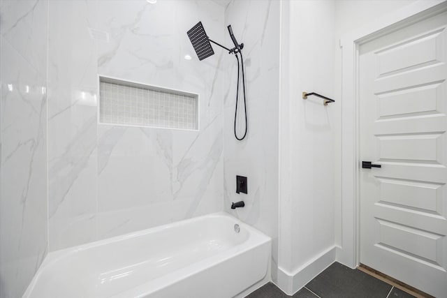 bathroom with tile patterned floors and tiled shower / bath combo