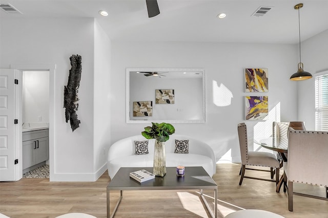 interior space with light hardwood / wood-style floors and ceiling fan