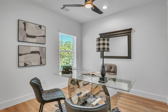 office area with hardwood / wood-style floors and ceiling fan