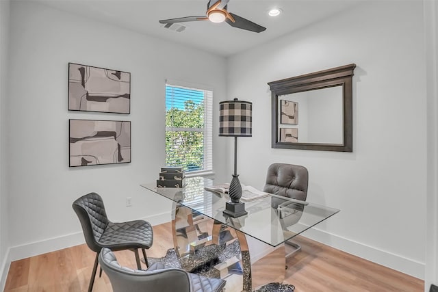 office space featuring hardwood / wood-style flooring and ceiling fan