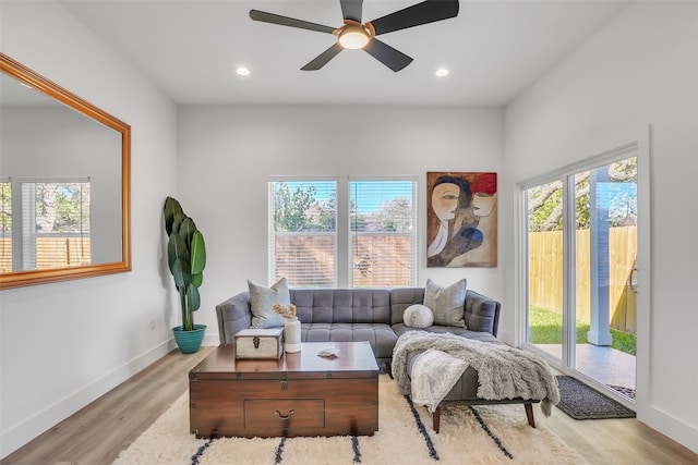 sitting room featuring light hardwood / wood-style flooring, plenty of natural light, and ceiling fan