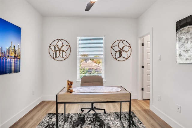 home office featuring ceiling fan and hardwood / wood-style floors