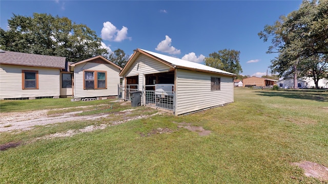 back of property with an outdoor structure