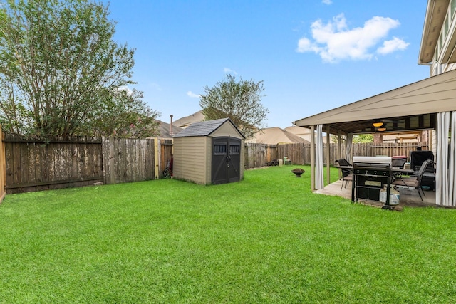 view of yard featuring a shed and a patio