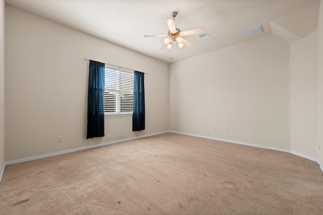 carpeted empty room featuring ceiling fan