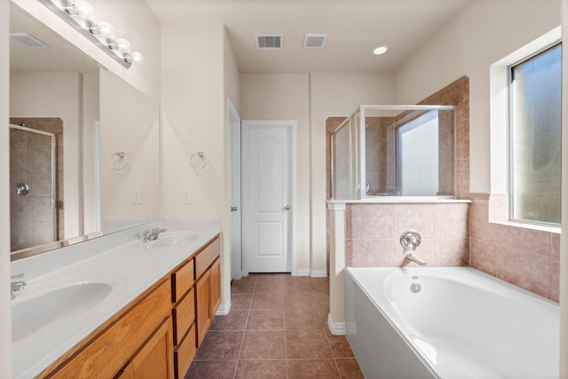 bathroom featuring tile patterned flooring, vanity, and independent shower and bath