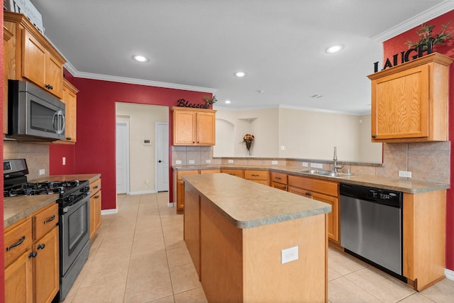 kitchen featuring sink, a center island, light tile patterned floors, appliances with stainless steel finishes, and kitchen peninsula