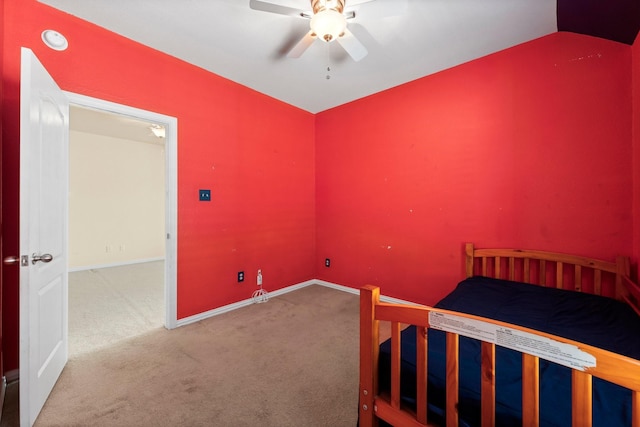 carpeted bedroom with lofted ceiling and ceiling fan