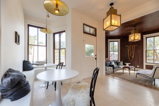 dining area with wooden walls