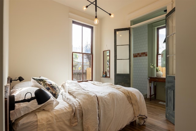 bedroom with wood-type flooring