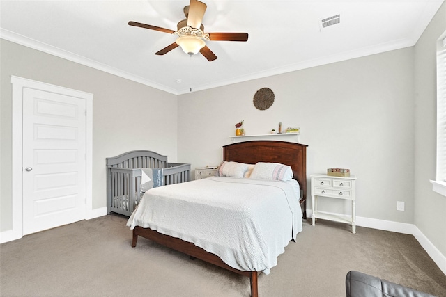 carpeted bedroom featuring crown molding and ceiling fan