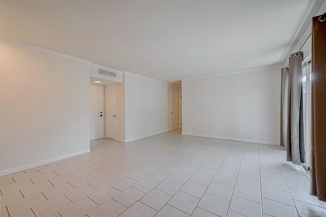 tiled spare room with ornamental molding