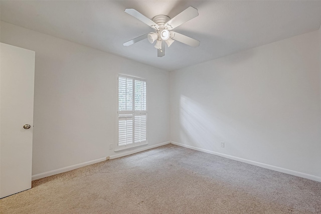 empty room featuring ceiling fan and carpet floors