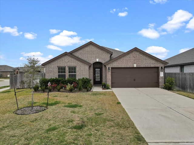 view of front of home with a garage and a front yard