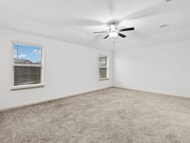 unfurnished room featuring carpet floors and ceiling fan